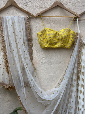 Ivory Ruffle Lehenga and Yellow Bustier Set image 1