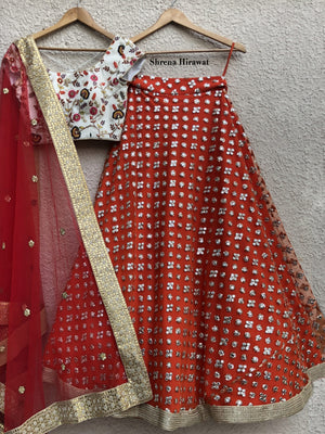 White Threadwork Blouse with Burnt Orange Lehenga image 0