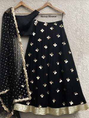 Black Satin Off-Shoulder Blouse with Black Gold Skirt - M image