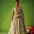 Beige Crushed Tissue Lehenga Set With Blue Dupatta