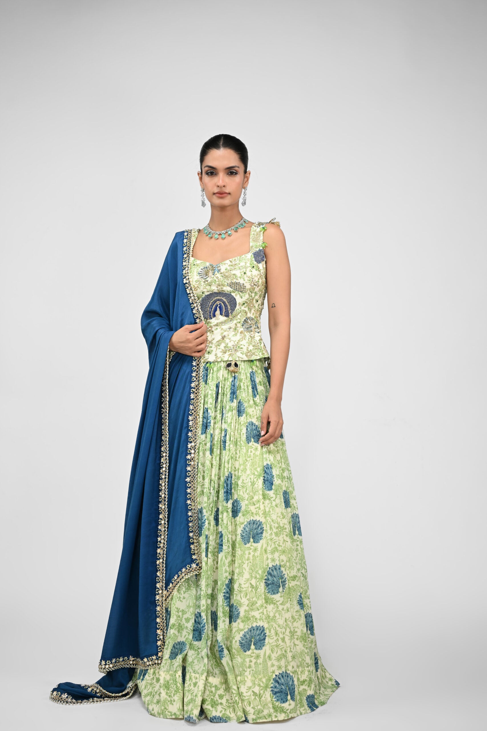 Peacock Highlighted Lehenga Paired with Highlighted Peacock Corset and Embroidered Dupatta - Custom image