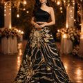 Black one Shoulder Blouse teamed with  a Black and Molten Gold Woven Skirt image 0