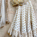 Ivory Gold Ruffle Lehenga Set With Yellow Mirror Blouse image 0