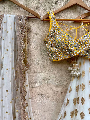 Ivory Gold Ruffle Lehenga Set With Yellow Mirror Blouse image 2