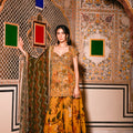 Yellow Embroidered Kurta paired with Printed Lehenga and Green Dupatta