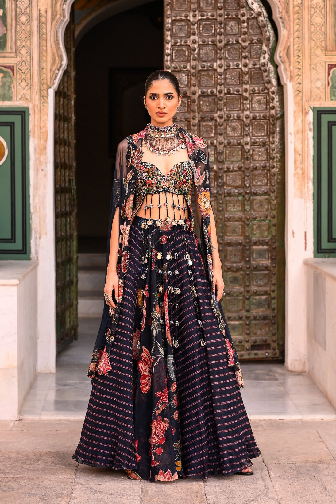 Dual Printed Lehenga With Embroidered Tassle Blouse With Applique Cape