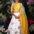 Yellow Blouse with White Lehenga image 0