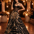 Black corset blouse with a laced back teamed with a black and molten gold woven skirt image 0