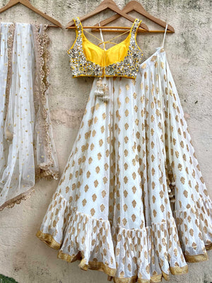Ivory Gold Ruffle Lehenga Set With Yellow Mirror Blouse image 4